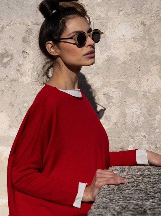 model wearing red merino sweater