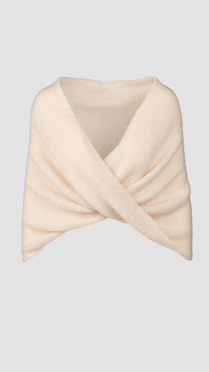 Knitted shawl with crossover design in pearl.