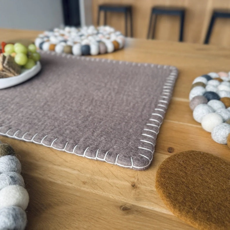 Felted table runner in fawn with contrast white blanket stitching.
