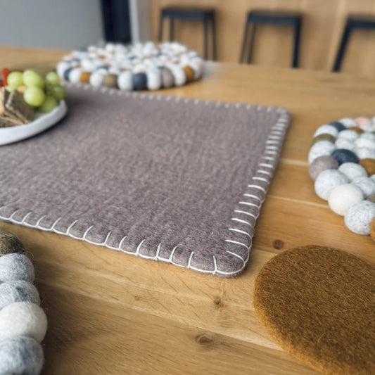 Felted table runner in fawn with contrast white blanket stitching.