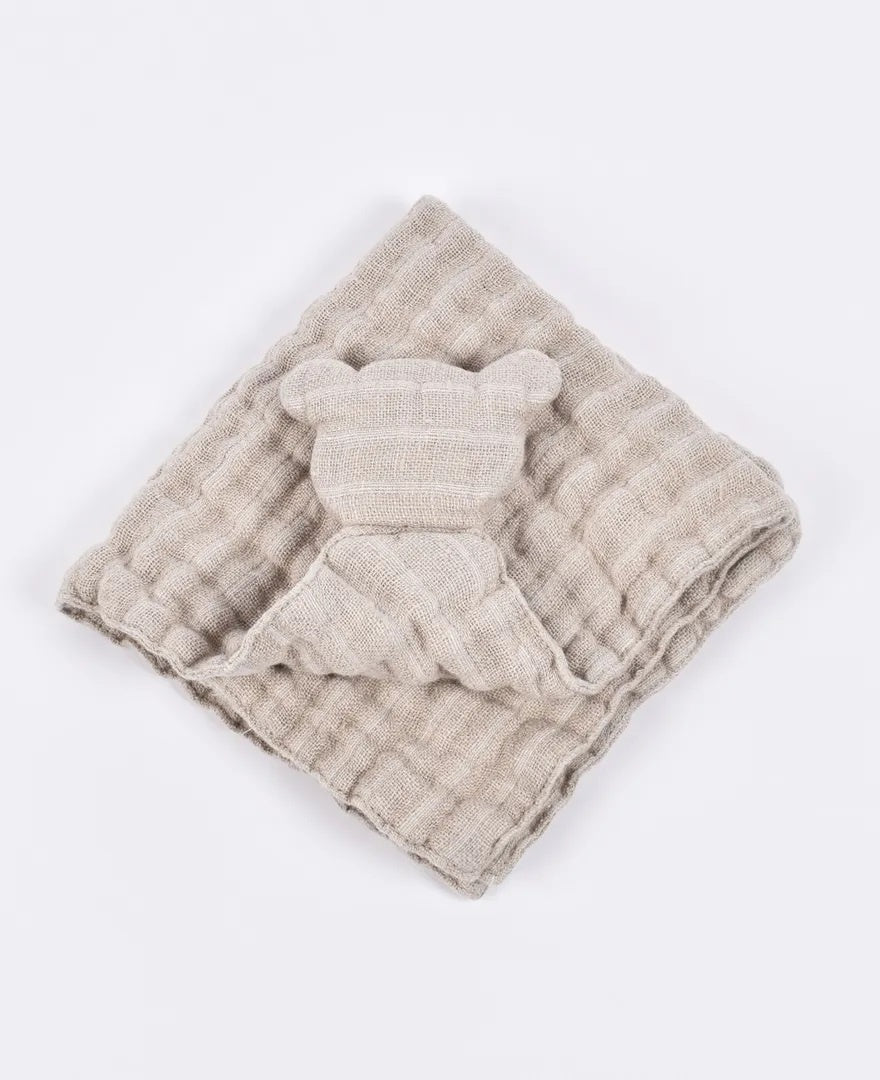 Beige linen baby blanket with soft teddy bear design on white background