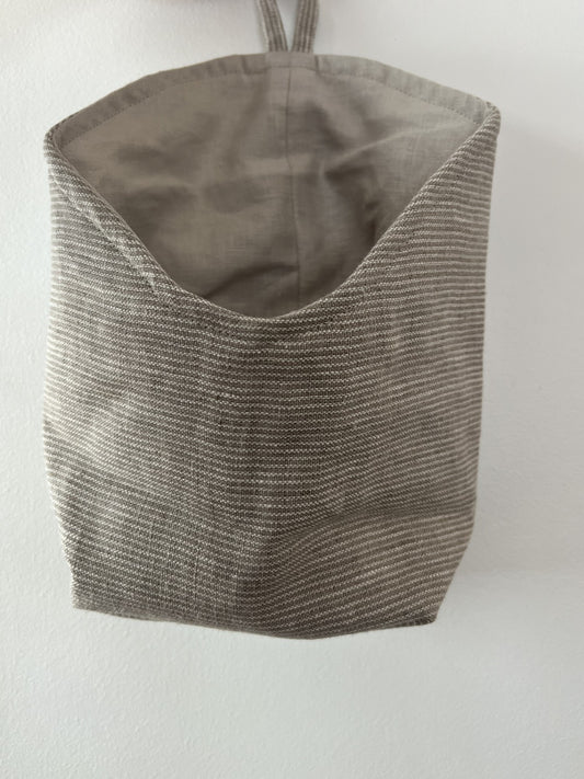 Linen storage basket with hook in natural linen stripe.