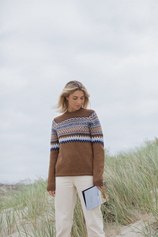 lady wearing brown nordic pattern sweater