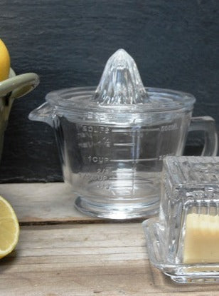 citrus juicer and butter dish glass