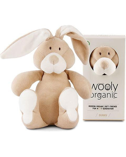 Soft beige and white organic bunny plush toy with long ears, next to product packaging.
