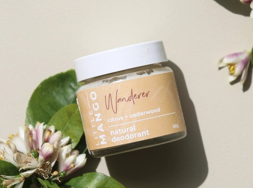 Wanderer Natural Deodorant on flowers