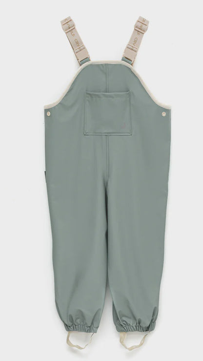 Rain overalls in moss.