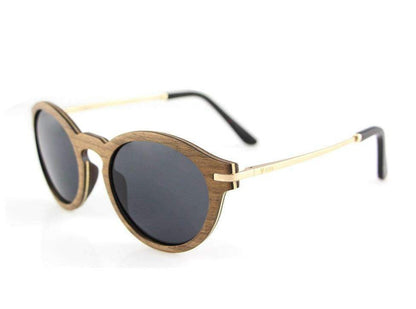 Round wooden sunglasses with dark lenses and gold metal arms on white background