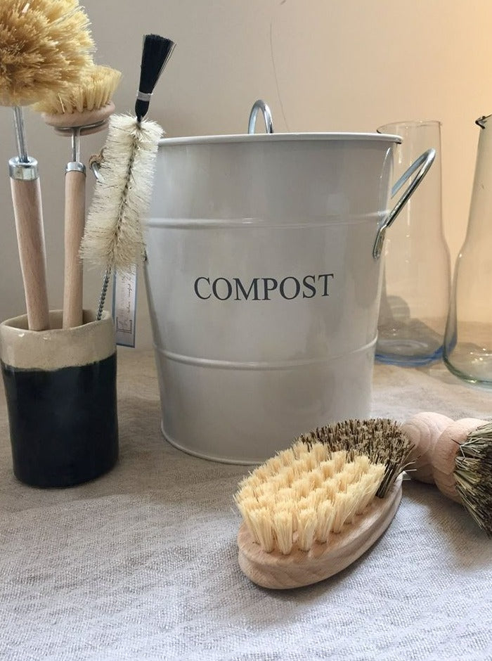 compost bucket cream colour and natural brushes