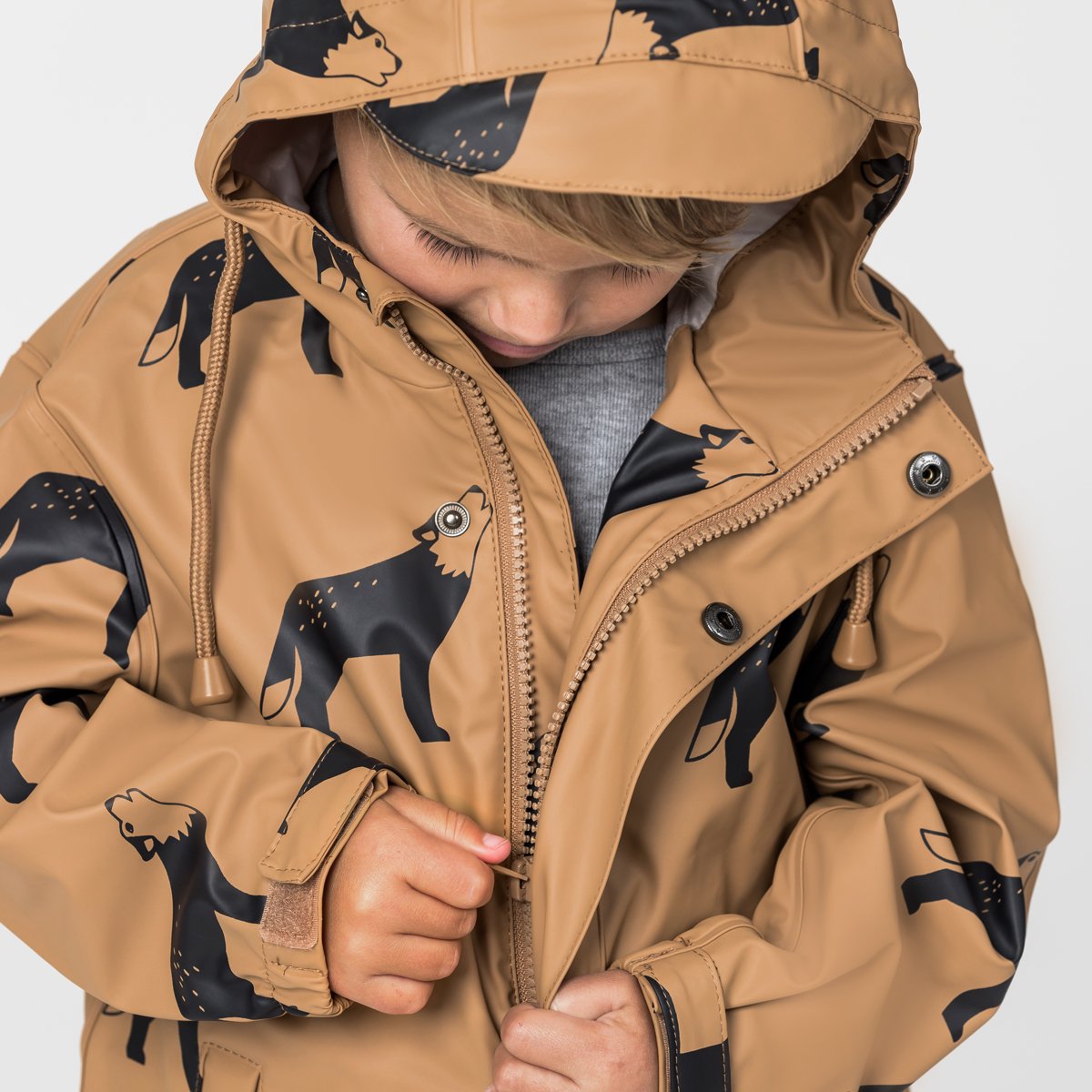 waterproof kids jacket brown front with a hood on