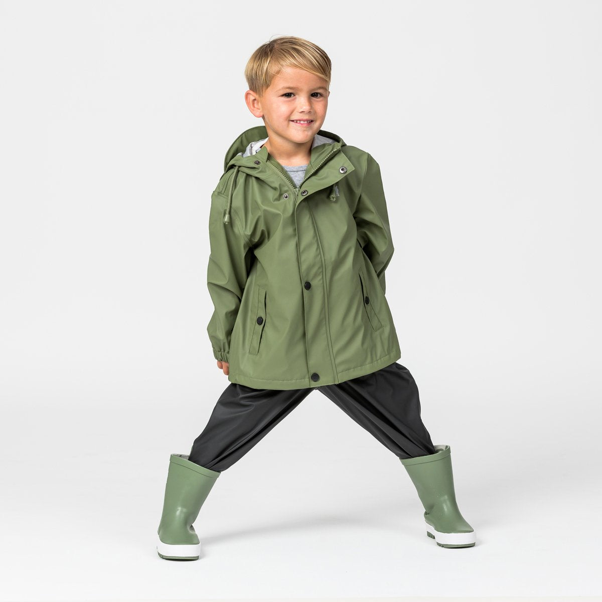 Kid wearing Crywolf Rain Jacket in green/khaki