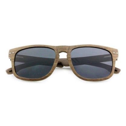 Wooden frame sunglasses with dark tinted lenses on white background
