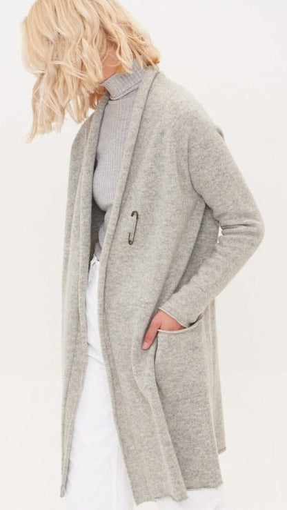 Lady wearing long merino cardigan grey