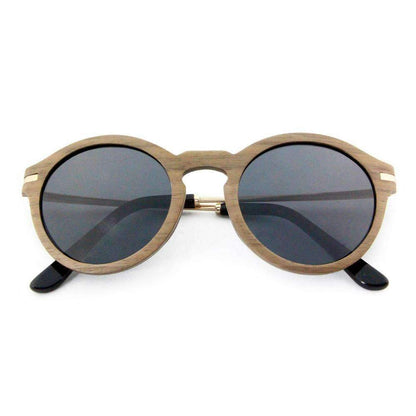 Round sunglasses with wood-look frame and dark lenses on white background