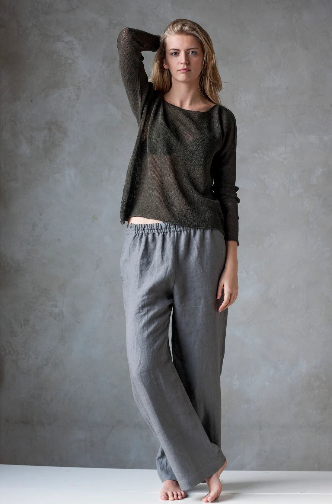 woman in grey knitted linen sweater
