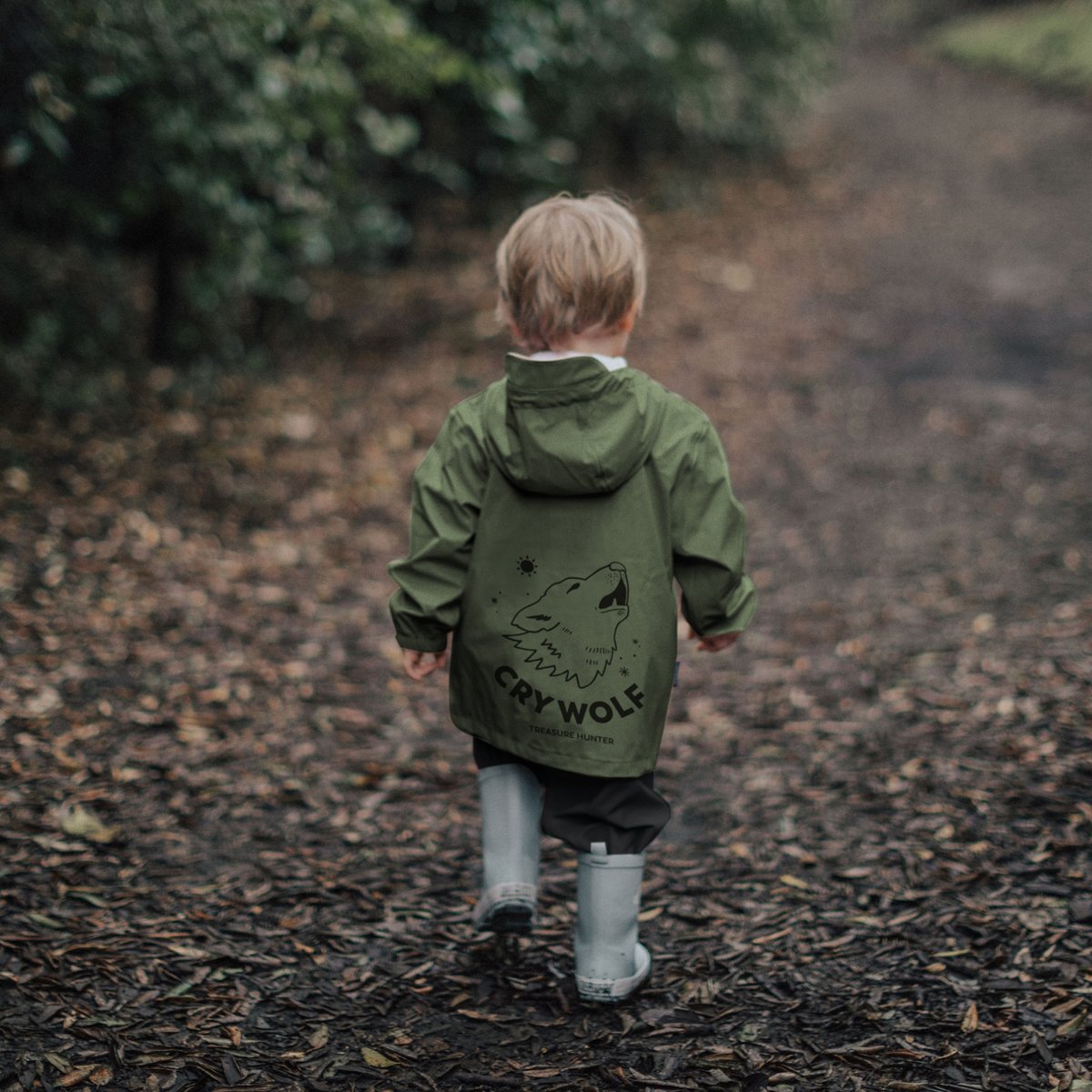 Toddler wearing Crywolf Rain Jacket in green