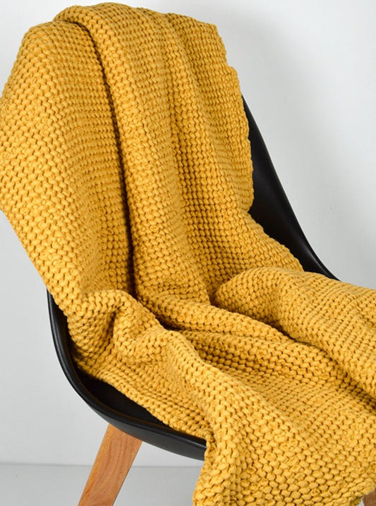 Mustard waffle towel over chair